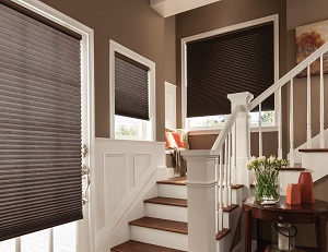 Motorized blackout shades near a staircase